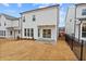 A home's backyard featuring a patio and lawn, great for outdoor activities and relaxation at 625 Skytop Dr, Cumming, GA 30040