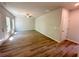 Spacious living room featuring wood-look flooring, a ceiling fan, and natural light at 66 Pine Creek Ct, Dallas, GA 30157