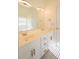 Elegant bathroom featuring a double vanity, gold hardware, and a large mirror at 1305 Bramlett Forest Trail Southeast Trl, Lawrenceville, GA 30045