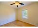 Cozy bedroom with hardwood floors, natural light from window, and ceiling fan at 1305 Bramlett Forest Trail Southeast Trl, Lawrenceville, GA 30045