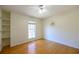 Bedroom featuring hardwood floors, built-in shelving, and a ceiling fan at 1305 Bramlett Forest Trail Southeast Trl, Lawrenceville, GA 30045