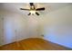 Bedroom with hardwood floors, two closets for storage and light fixture at 1305 Bramlett Forest Trail Southeast Trl, Lawrenceville, GA 30045
