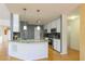 Modern kitchen featuring stainless steel appliances, granite countertops, and stylish cabinetry, with sleek hardwood floors at 1305 Bramlett Forest Trail Southeast Trl, Lawrenceville, GA 30045