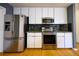 Elegant kitchen featuring stainless steel appliances, stylish cabinets, and a granite countertop, perfect for culinary enthusiasts at 1305 Bramlett Forest Trail Southeast Trl, Lawrenceville, GA 30045