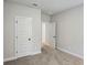 Spacious bedroom boasts soft carpet, neutral walls, and a view of the hall at 241 Martin Spring, Lawrenceville, GA 30045