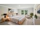 Staged bedroom featuring a serene view, sleek furniture, and contemporary artwork at 241 Martin Spring, Lawrenceville, GA 30045