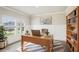 Office space with desk, bookshelf, and natural light, decorated with plants and a modern aesthetic at 241 Martin Spring, Lawrenceville, GA 30045