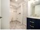 This bathroom features a modern vanity and is adjacent to a laundry area at 2983 Peek Nw Rd, Atlanta, GA 30318