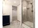 This bathroom showcases a glass shower, a vanity, and easy access to other rooms at 2983 Peek Nw Rd, Atlanta, GA 30318