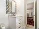 This bathroom features a modern vanity with a marble countertop, a geometric mirror, and stylish fixtures at 2983 Peek Nw Rd, Atlanta, GA 30318