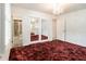 This bedroom features a chandelier and mirrored closet doors, providing ample storage at 2983 Peek Nw Rd, Atlanta, GA 30318