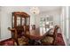 Dining room with wooden furniture, chandelier, and shutters, offering elegance at 2983 Peek Nw Rd, Atlanta, GA 30318
