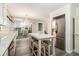 Renovated kitchen with stainless steel appliances, white cabinetry, large island with seating, and breakfast bar at 2983 Peek Nw Rd, Atlanta, GA 30318