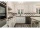 Clean and updated kitchen includes stainless steel appliances, white cabinets, and a tile backsplash at 2983 Peek Nw Rd, Atlanta, GA 30318