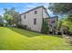 Backyard with lush green lawn and manicured landscaping leading to the home's outdoor features at 3015 Southmoor Trce, Roswell, GA 30075