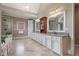 Elegant bathroom with a double sink vanity, granite counters, marble floors, tub, and shower at 3015 Southmoor Trce, Roswell, GA 30075