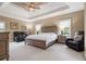 Large bedroom featuring a trey ceiling, neutral tones, and furnishings at 3015 Southmoor Trce, Roswell, GA 30075