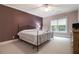 Comfortable bedroom with a wrought iron bed frame, soft carpet and natural light from the window at 3015 Southmoor Trce, Roswell, GA 30075