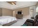 Spacious bedroom featuring a trey ceiling, neutral tones, and walk-in bathroom at 3015 Southmoor Trce, Roswell, GA 30075