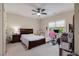 Comfortable bedroom with natural light, ceiling fan, a bed and adjacent study area for focus at 3015 Southmoor Trce, Roswell, GA 30075