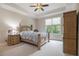 Serene bedroom with neutral tones, tray ceiling, and a large window at 3015 Southmoor Trce, Roswell, GA 30075