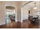 Elegant dining room features hardwood floors, wainscoting, a modern chandelier, and an open layout, perfect for entertaining at 3015 Southmoor Trce, Roswell, GA 30075