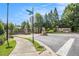Stonegrove entrance gate featuring stone pillars, lush landscaping, and signage, creating an inviting sense of arrival at 3015 Southmoor Trce, Roswell, GA 30075