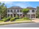 Elegant two-story home with a brick facade, manicured landscaping, and a two-car garage at 3015 Southmoor Trce, Roswell, GA 30075