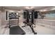 Well equipped home gym with mirrored walls, treadmill, and weight training station at 3015 Southmoor Trce, Roswell, GA 30075