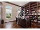 Well-lit home office with custom built-ins and hardwood floors at 3015 Southmoor Trce, Roswell, GA 30075