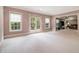 Spacious bonus room with bright windows, French doors to outside, and an open layout to the living room at 3015 Southmoor Trce, Roswell, GA 30075