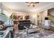 Cozy living room with hardwood floors, neutral walls, and an open layout offering seamless flow to the kitchen at 3015 Southmoor Trce, Roswell, GA 30075