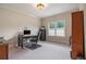 Bright office space with a large window, neutral walls, and a dark desk at 3015 Southmoor Trce, Roswell, GA 30075