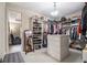Spacious walk-in closet with ample shelving and storage, and a view to the lounge area at 3015 Southmoor Trce, Roswell, GA 30075