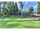 Serene backyard showcasing lush green grass, beautiful landscaping and privacy fence at 4845 Dartford Dr, Powder Springs, GA 30127