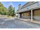 Backyard features a covered porch, patio, and a well-maintained gravel area at 4845 Dartford Dr, Powder Springs, GA 30127