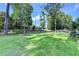 The expansive backyard features lush green grass and garden at 4845 Dartford Dr, Powder Springs, GA 30127