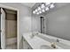 Bright bathroom featuring double vanity, neutral tones, and a tub-shower combination at 4845 Dartford Dr, Powder Springs, GA 30127