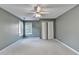 Bedroom with neutral paint, carpet, ceiling fan, and closet at 4845 Dartford Dr, Powder Springs, GA 30127