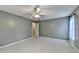 Bedroom with neutral paint, carpet, and ceiling fan at 4845 Dartford Dr, Powder Springs, GA 30127
