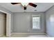 Bedroom with neutral paint, carpet, and ceiling fan at 4845 Dartford Dr, Powder Springs, GA 30127
