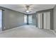 Bedroom with neutral paint, carpet, ceiling fan, and closet at 4845 Dartford Dr, Powder Springs, GA 30127