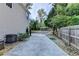 Long driveway and landscaped backyard providing ample parking and outdoor space at 4845 Dartford Dr, Powder Springs, GA 30127