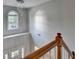 Foyer with a modern chandelier, a large window, and a wooden staircase at 4845 Dartford Dr, Powder Springs, GA 30127
