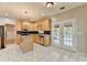 Kitchen with stainless steel appliances, central island and double glass doors at 4845 Dartford Dr, Powder Springs, GA 30127