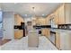 Open concept kitchen features stainless steel appliances, island, and tiled floor at 4845 Dartford Dr, Powder Springs, GA 30127