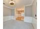 Carpeted living room with gray walls, white trim, and an open view into the adjacent dining room at 4845 Dartford Dr, Powder Springs, GA 30127