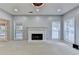 Spacious living room with a painted brick fireplace and carpeted floors at 4845 Dartford Dr, Powder Springs, GA 30127
