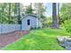 A charming backyard outbuilding with a window, siding, and well-kept lawn at 4845 Dartford Dr, Powder Springs, GA 30127