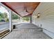 Outdoor covered patio with brick accents, offering a serene view of the backyard at 4845 Dartford Dr, Powder Springs, GA 30127